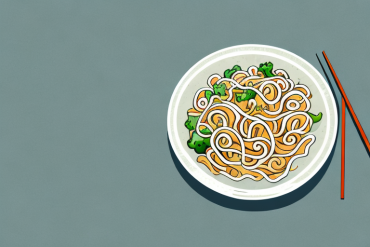 A bowl of noodles with vegetables and a sauce
